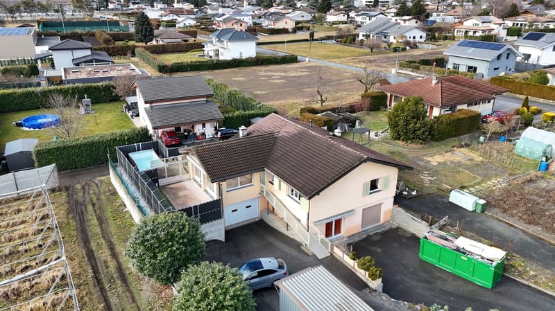 Two houses, brown roofs, gardens, swimming pool, garage, parking space