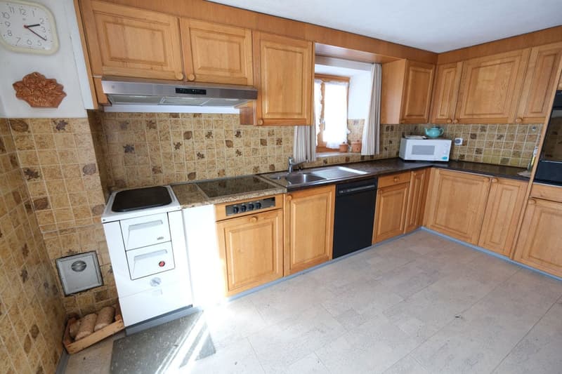 kitchen with wooden cabinets, tiled backsplash, white appliances, sink, microwave, dishwasher, stove
