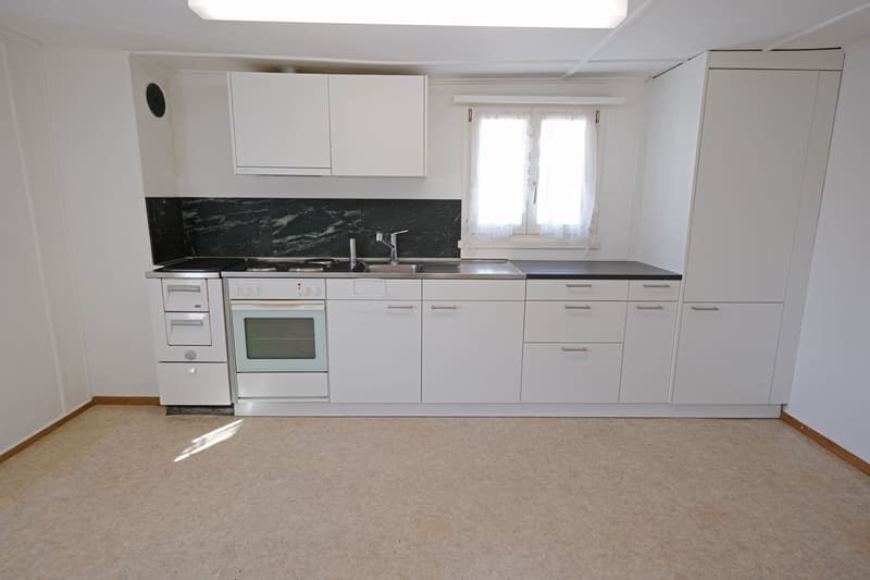 modern kitchen with white cabinets, granite countertop, oven, dishwasher, sink, faucet, window with white curtains
