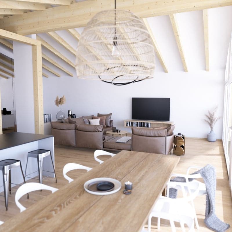 Open-plan living and dining area with wooden floor, white walls, large windows, wooden dining table, white chairs, brown leather sofa, flat-screen TV, wooden beams, pendant light, kitchen island with stools