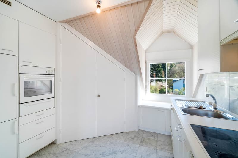 modern kitchen, white cabinets, marble floor, built-in oven, dishwasher, sink, faucet, window