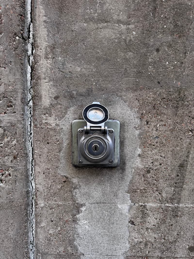 Lock box mounted on the concrete wall.