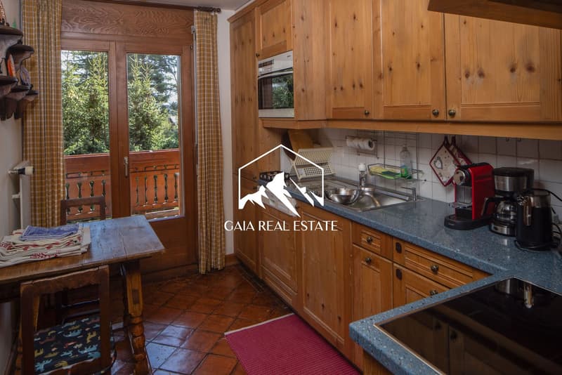 wooden cabinets, stainless steel sink, granite countertop, kitchen appliances