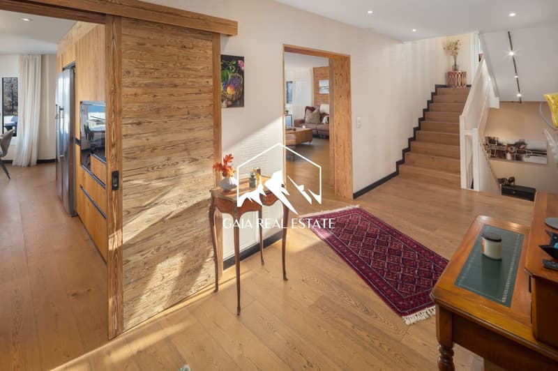 wooden floor, wooden wall, table, rug, staircase, refrigerator, painting, window