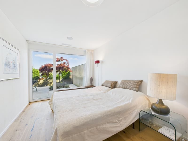 clean, white room, two twin beds, pillows, double sliding glass doors, balcony