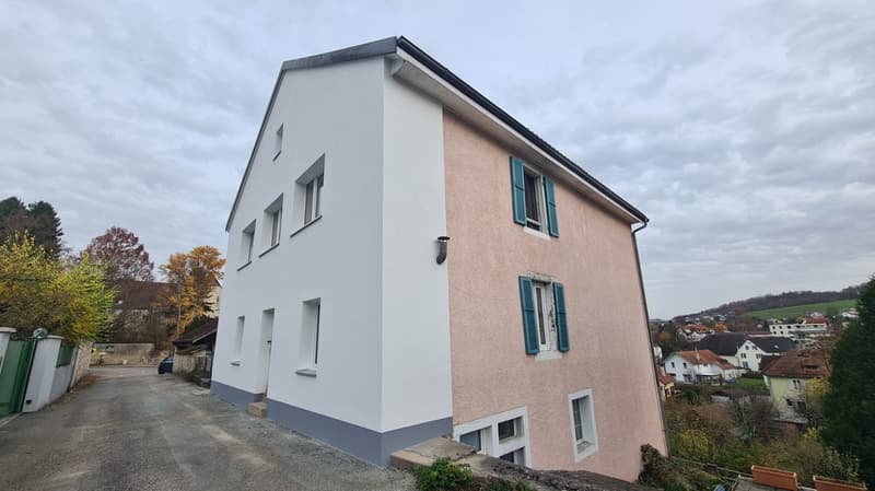 3 story house, white and pink wall, gray trim, windows, driveway, 4 windows on each side