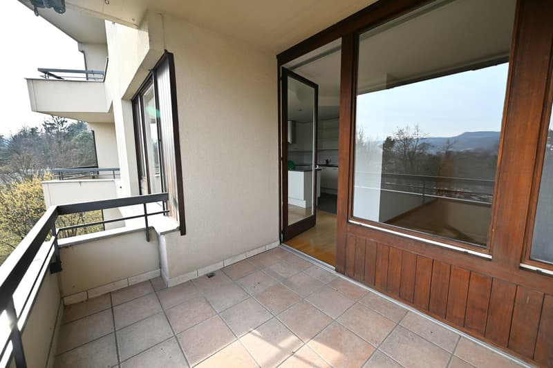 tiled floor, balcony, large windows, view of mountains