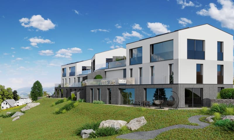 two story apartment, raised ground floor, large windows, balconies, grassy terrain, several trees