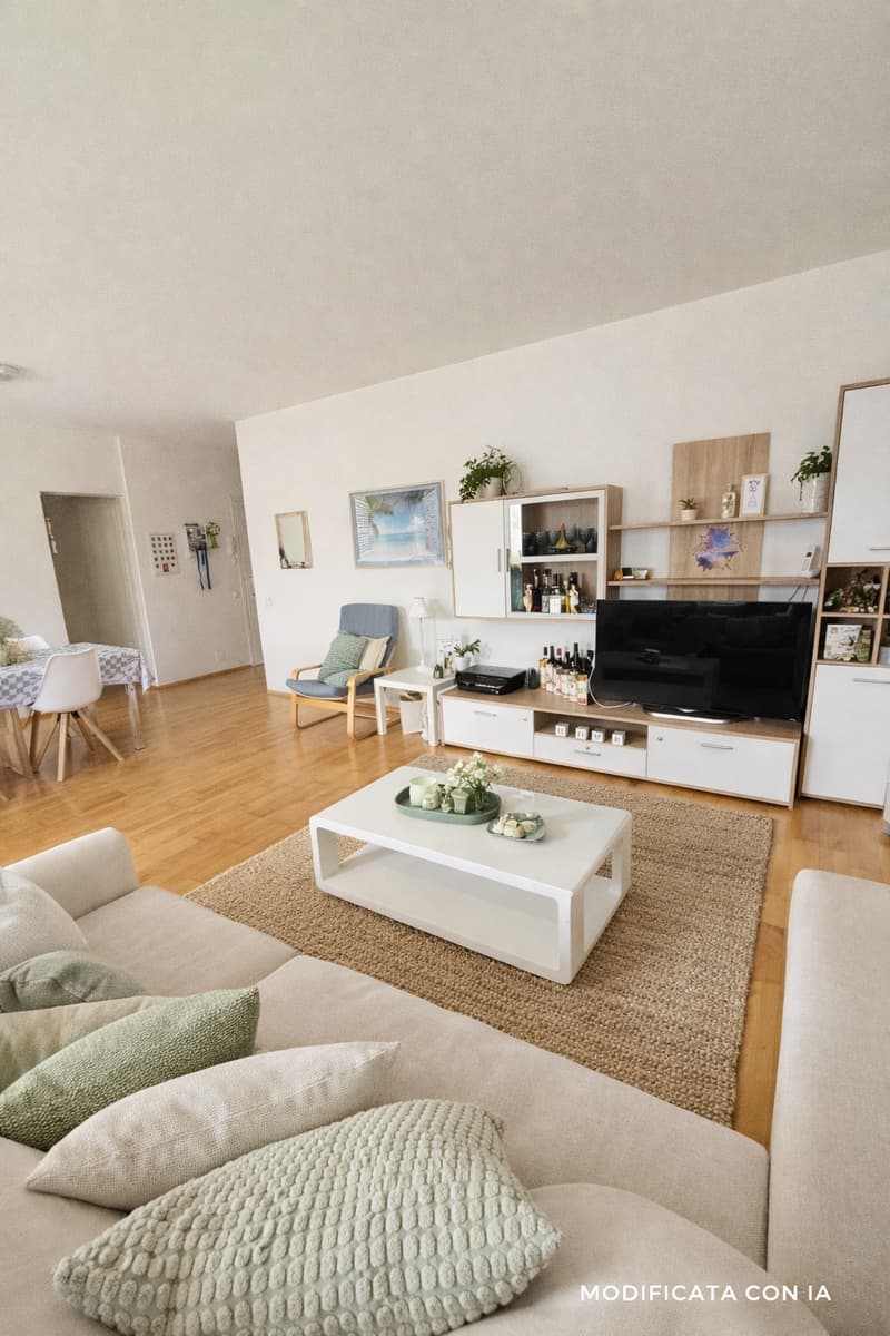 living room with couch, coffee table, TV, shelves, dining table, chairs, plants