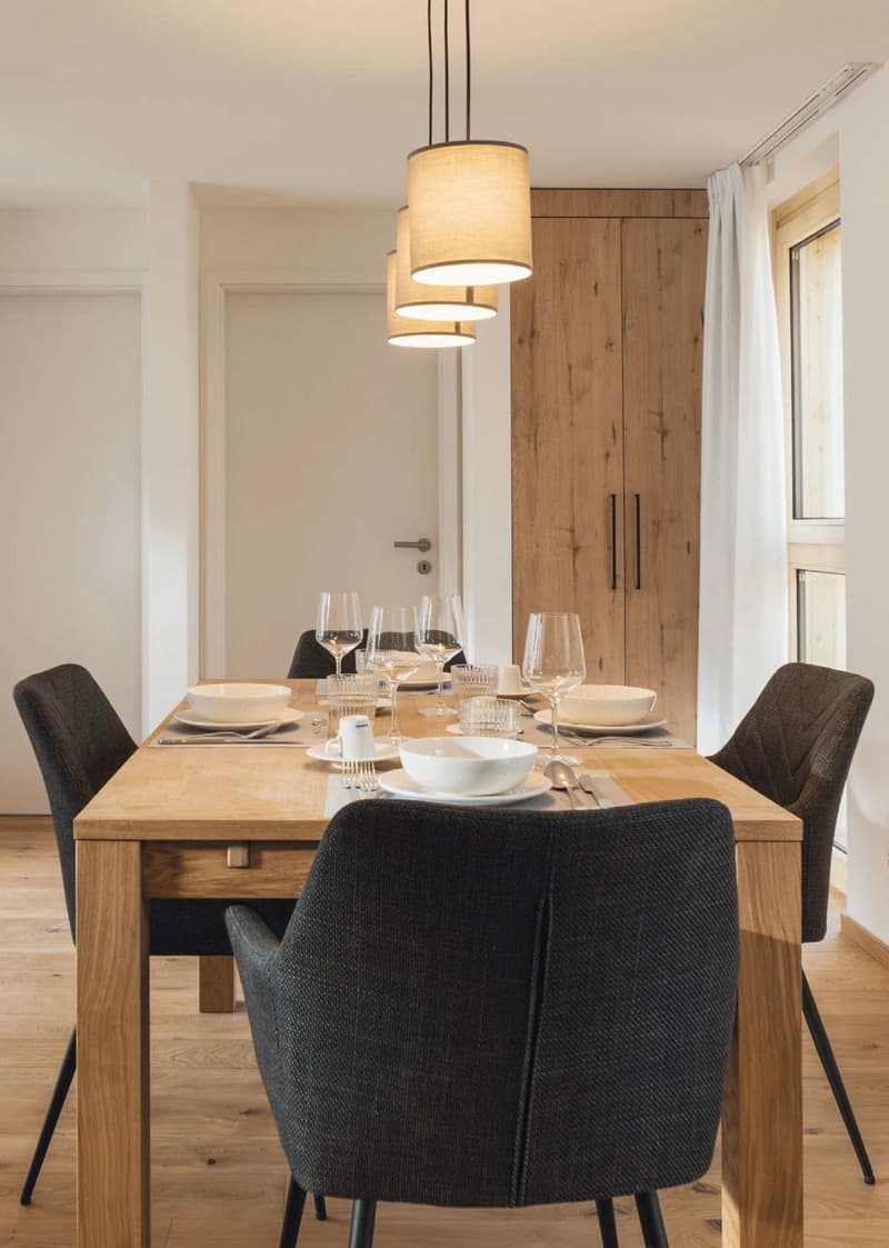 wooden dining table, 6 chairs, bowls, wine glasses, wooden floor