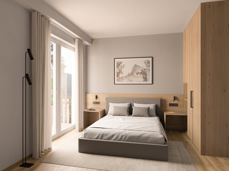 double bed with two pillows, white sheets, nightstands with lamps, picture frame, sliding glass door with curtains, balcony, wooden wardrobe