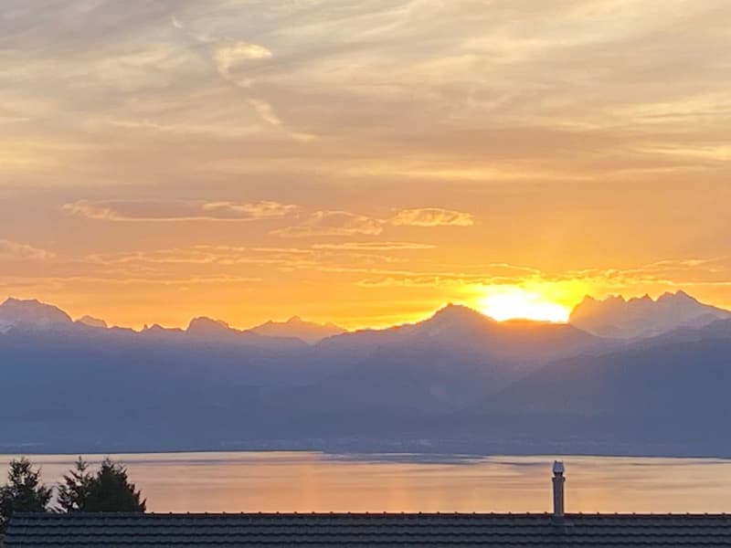 Sunset over mountains and lake