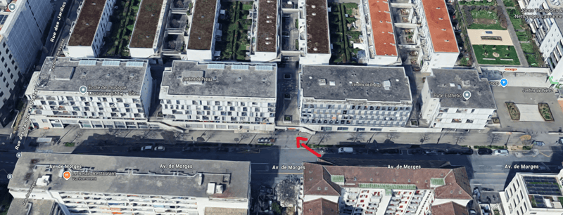 Urban area with various buildings of different sizes and architectural styles. Street named Av. de Morges runs through the area, with several buildings along it. Some buildings have green roofs.