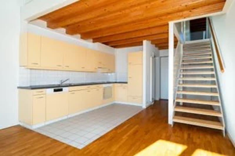 modern kitchen with wooden floor, white tiles, wooden ceiling, yellow cabinets, stainless steel sink, dishwasher