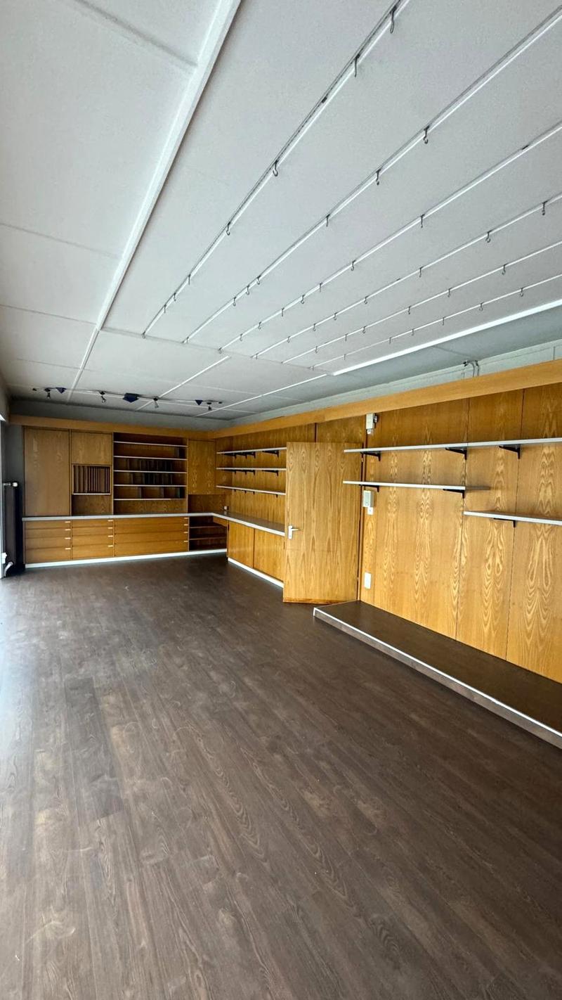 wood floor, empty room, wooden shelves, large open space