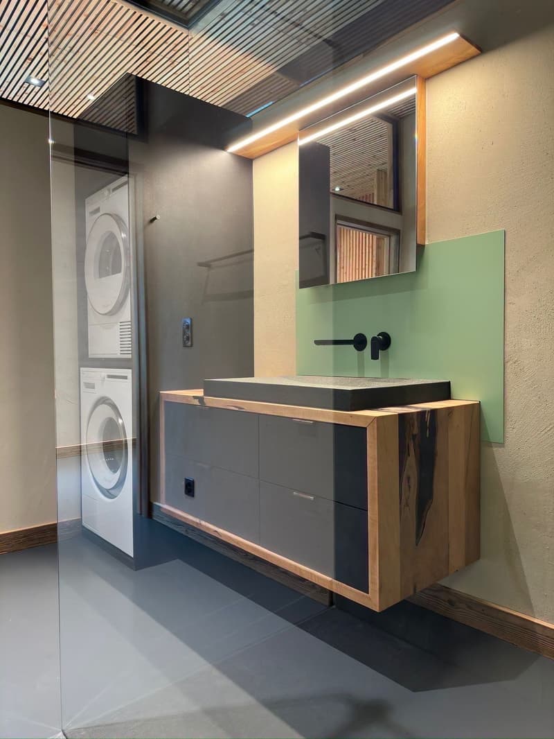 washer, mirror, sink, faucet, cabinet, power outlet