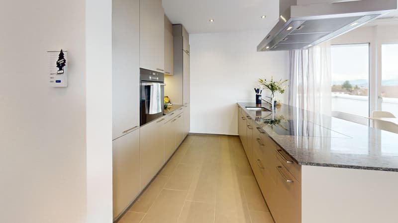modern kitchen with granite countertops, stainless steel appliances, white cabinets, tiled floor, large window