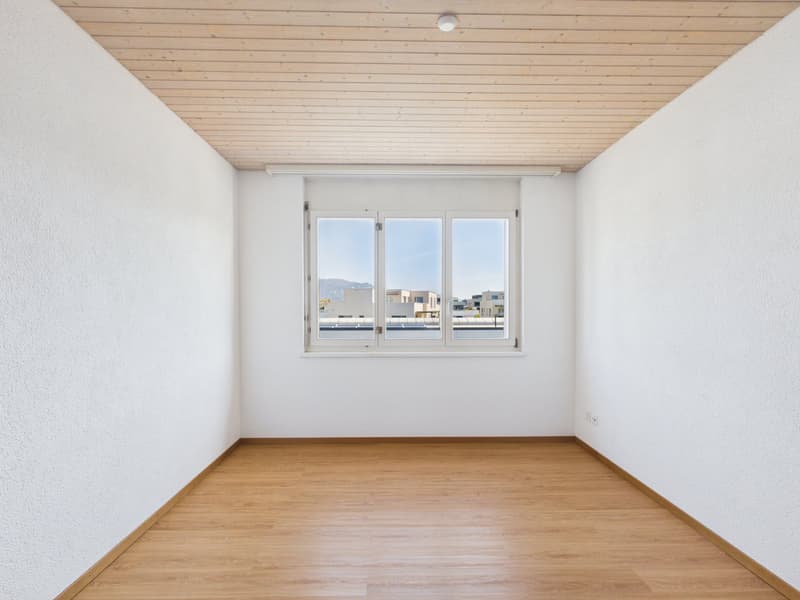 empty room, white walls, wooden floor, large window, wooden ceiling