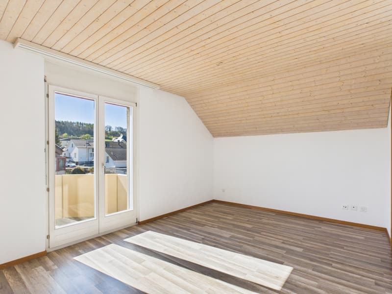 empty room, wooden floor, white walls, large glass doors, balcony