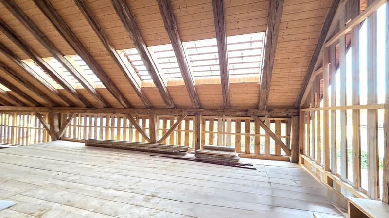 unfinished room, wooden floor, wooden beams, glass windows, unfinished