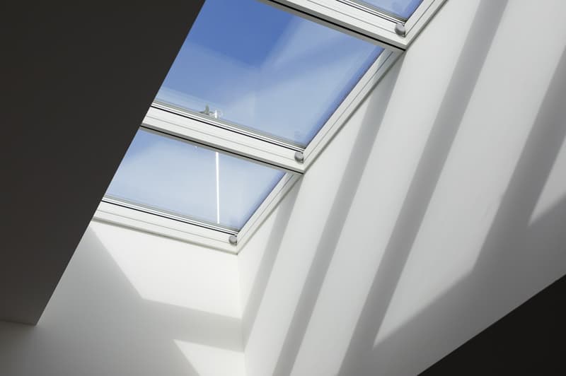 Large skylight windows, bright and airy space, white walls, modern design