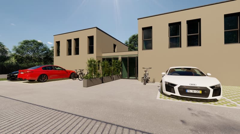 Modern two-story building, brown exterior walls, white windows, glass entrance, bicycles parked, 3 cars parked