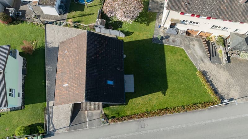 House with garage, swimming pool, and a garden