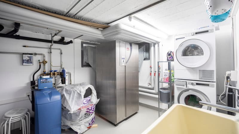 Laundry room with washing machine, dryer, and sink