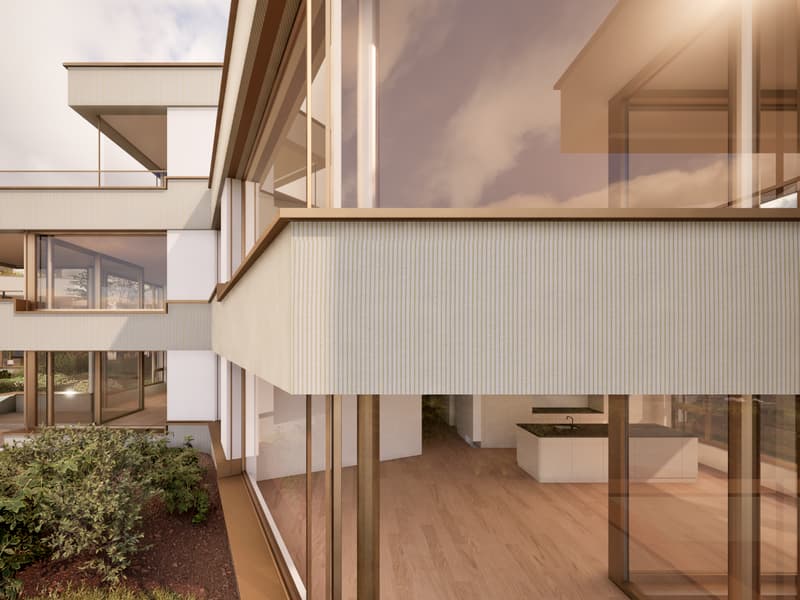 Modern two-story house with large windows, balcony, and wooden exterior details. The interior features an open floor plan with hardwood floors and a kitchen visible through the glass walls.