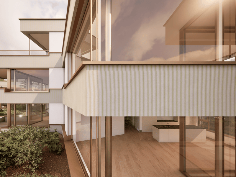 Modern two-story house with large windows, balcony, and wooden exterior details. The interior features an open floor plan with hardwood floors and a kitchen visible through the glass walls.