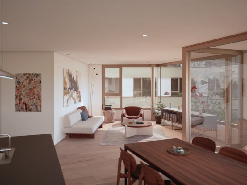 Spacious open-concept living room with large windows providing a scenic view, hardwood floors, white walls, modern furniture including a white sofa, a red armchair, and a wooden dining table with chairs, artwork on the walls, and a bookshelf.