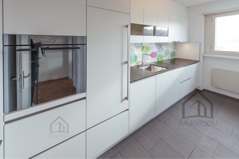modern white kitchen, stainless steel oven, granite countertop, sink with faucet, wooden floor