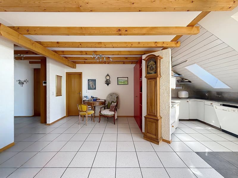 white tiled floor, wooden beams, dining table, chairs, wooden grandfather clock, kitchen with dishwasher
