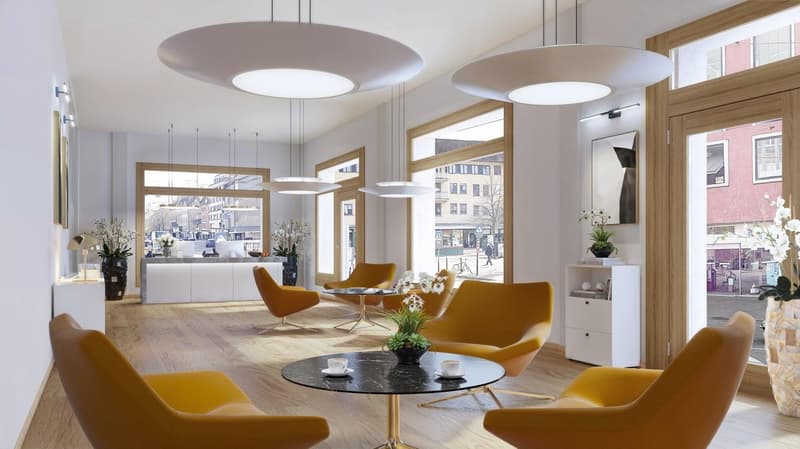 large windows, chandeliers, wood floors, yellow couches, round table, coffee, plants