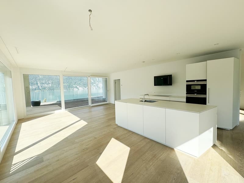 modern kitchen with island, large windows, balcony, high ceiling, wooden floor