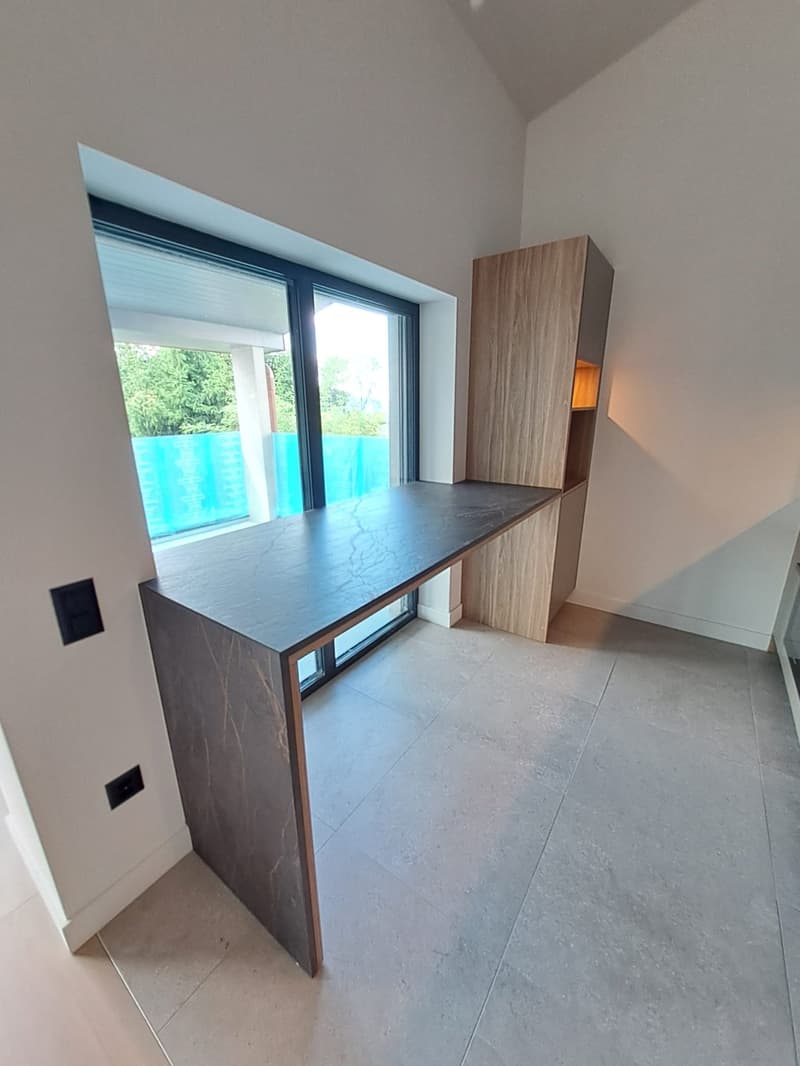 Large office desk, large window, wooden cabinet, tiled floor, white walls