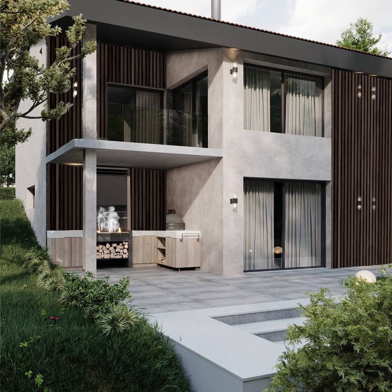 Two-story modern house with a combination of white stucco and dark wooden siding. The house features a balcony/terrace, large windows, and an outdoor fireplace area with firewood storage.