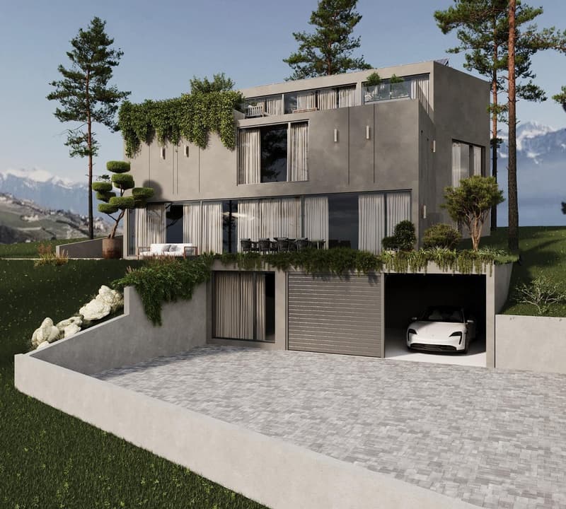 Two-story modern house with gray exterior, large windows, balconies, and a garage. The house is surrounded by landscaping, including trees and shrubs. The driveway is paved with gray bricks.
