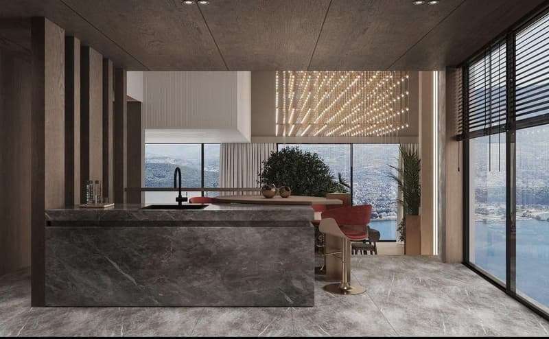 Luxury modern kitchen with large windows offering a scenic view, dark marble countertops, built-in appliances, and decorative lighting fixtures.