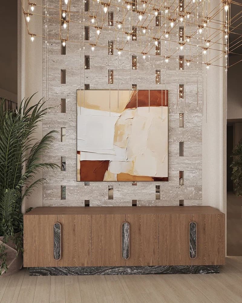 Luxurious living room with a modern, abstract art piece on the wall, surrounded by a grid of hanging lights. The room features a wooden cabinet with marble accents, and a potted plant adds a touch of greenery. The overall design has a sleek, contemporary