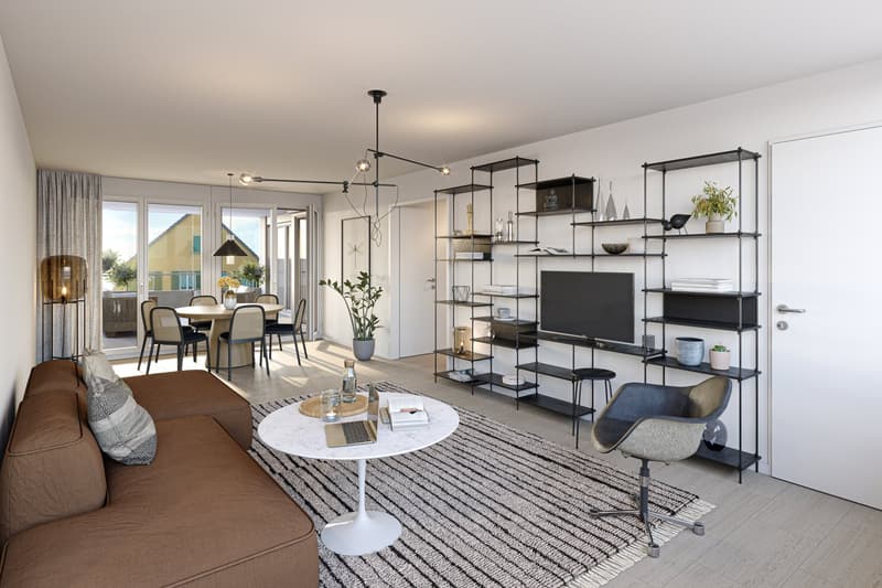 Open-concept living room and dining area, hardwood floors, large windows, modern furniture including a sofa, coffee table, and dining table with chairs, shelving unit with TV, and a balcony or terrace visible through the windows.