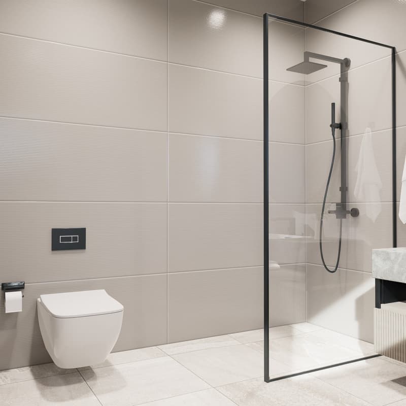 Modern bathroom with white tiles, black framed glass shower enclosure, and a white toilet