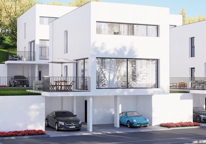 Modern, multi-story white building with large windows, balconies, and a garage with parking spaces in the front
