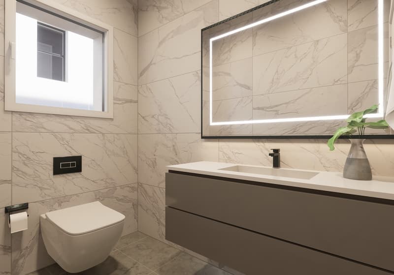 Spacious bathroom with marble-like tiles, a wall-mounted vanity with a sink, a toilet, and a large mirror with built-in lighting. The room has a modern and minimalist design.