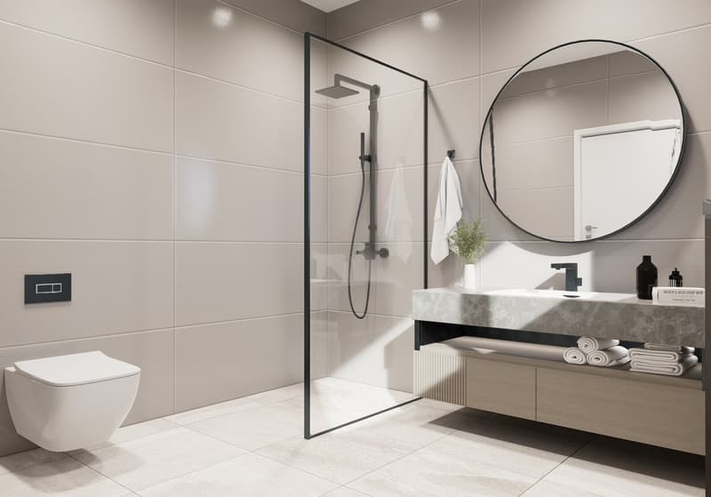 Modern bathroom with gray tile walls, a glass shower enclosure, a floating vanity with a marble countertop, a round mirror, and a toilet.