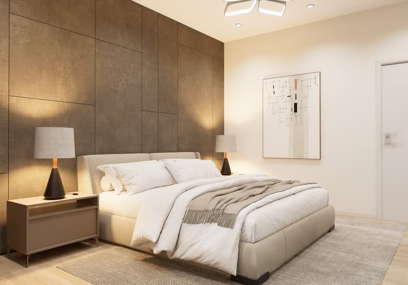 Spacious bedroom with a large bed, white bedding, and a modern abstract artwork on the wall. The room features a textured accent wall in a dark brown color, and two bedside tables with lamps. The floor is covered with a neutral-colored rug.