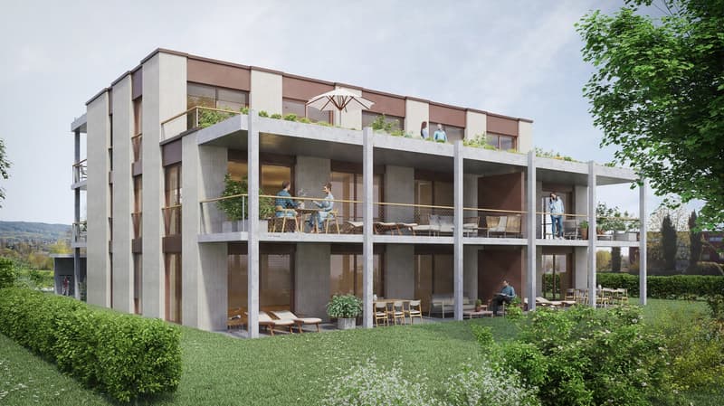 Multi-story apartment building with balconies, surrounded by greenery and landscaping. The building has a modern, minimalist design with clean lines and large windows. People can be seen on some of the balconies.