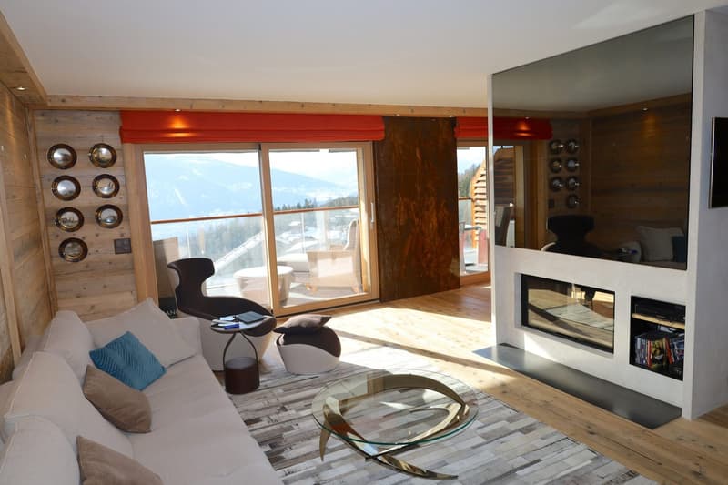 modern, wood wall, large windows, fireplace, coffee table, couch, armchair