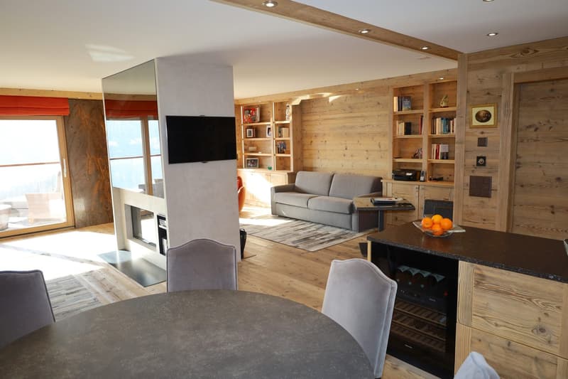 wooden wall, wooden floor, fireplace, couch, tv, dining table, chairs