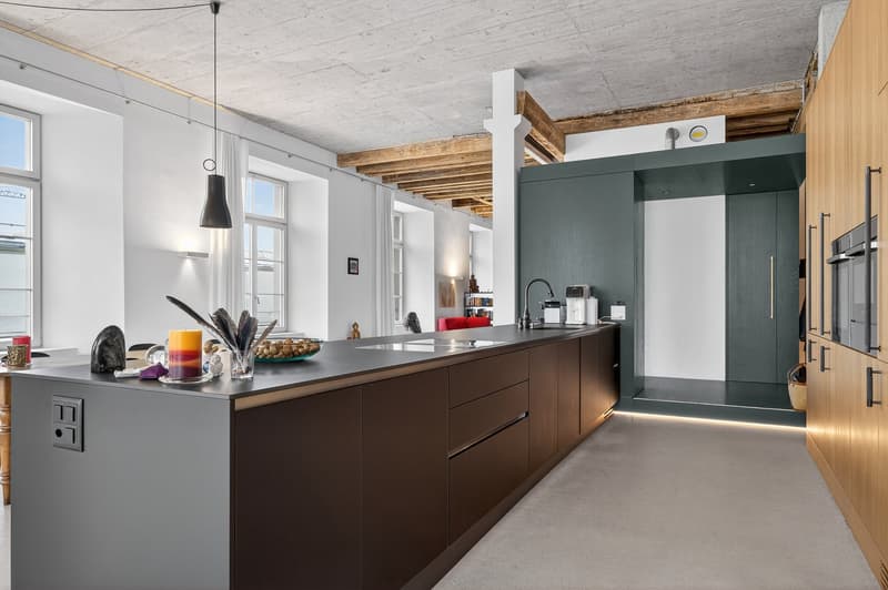open kitchen, stainless steel countertops, wooden cabinets, 2 sinks, faucet, coffee machine, large windows